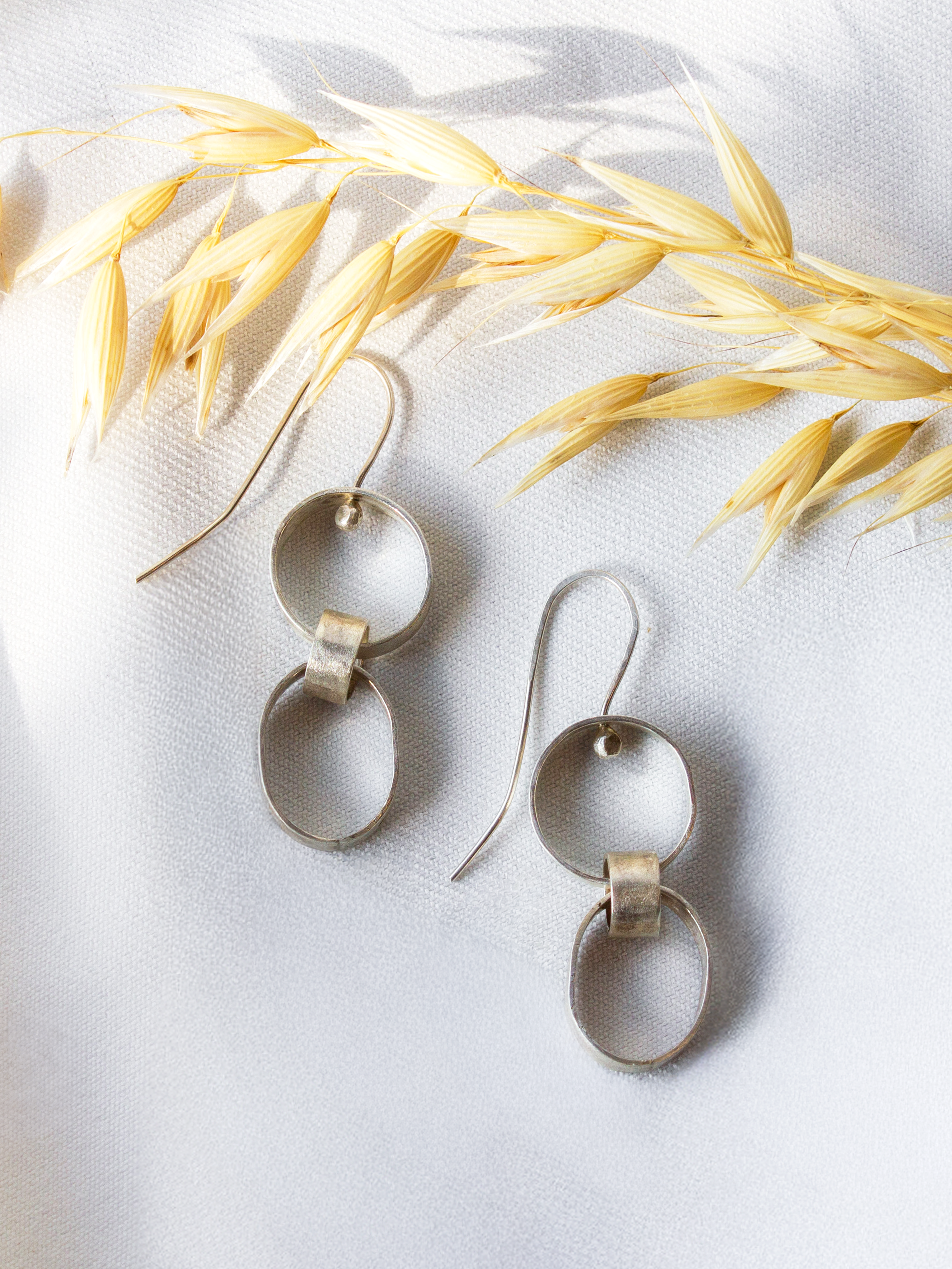 Galili Ellis, Linked Silver Closed Shape Dangle Earrings